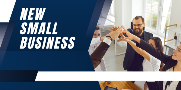 A group of happy coworkers in an office engages in a team huddle, their hands raised in unity. Bold text on the left reads "New Small Business" on a blue and white geometric background, reflecting the optimism of their venture into the world of small business banking.